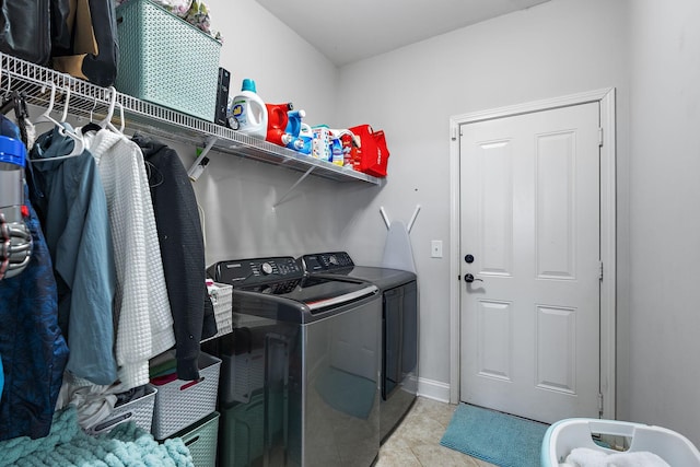 washroom with light tile patterned flooring and independent washer and dryer