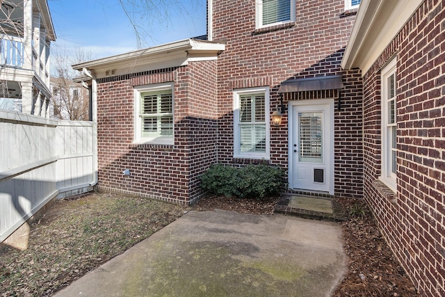 entrance to property featuring a patio area