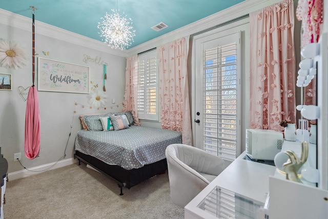 carpeted bedroom featuring multiple windows, crown molding, and an inviting chandelier