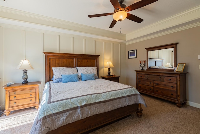 bedroom with crown molding, ceiling fan, and carpet flooring