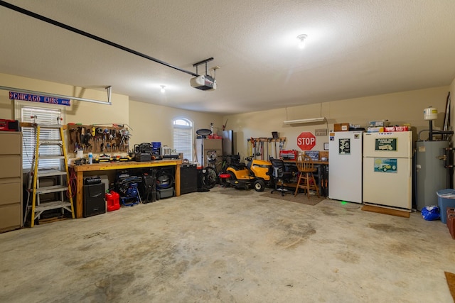 garage featuring white fridge, water heater, a garage door opener, and a workshop area