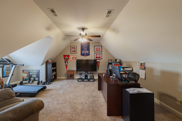 home office with vaulted ceiling, light colored carpet, and ceiling fan