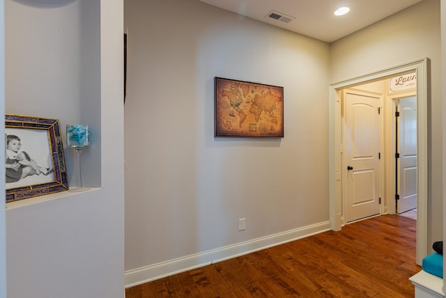 hallway featuring wood-type flooring