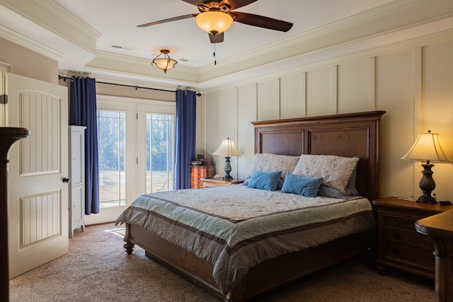 carpeted bedroom featuring crown molding and ceiling fan