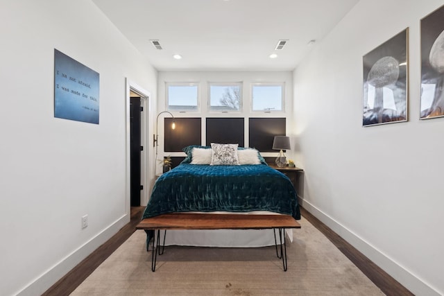 bedroom featuring hardwood / wood-style flooring