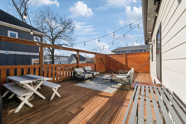 wooden deck featuring an outdoor living space