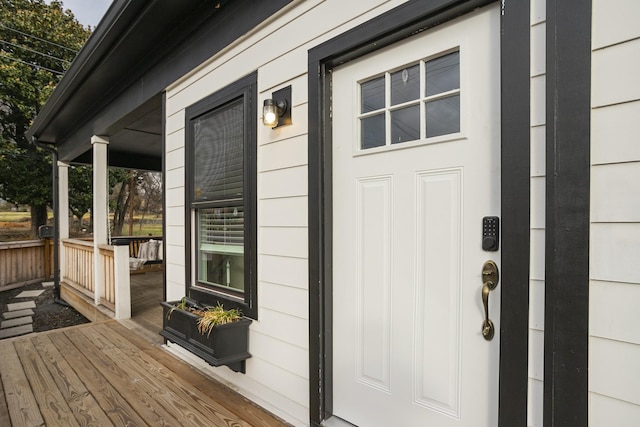 view of exterior entry featuring a porch