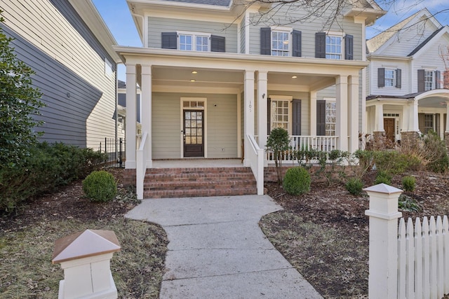 entrance to property featuring covered porch