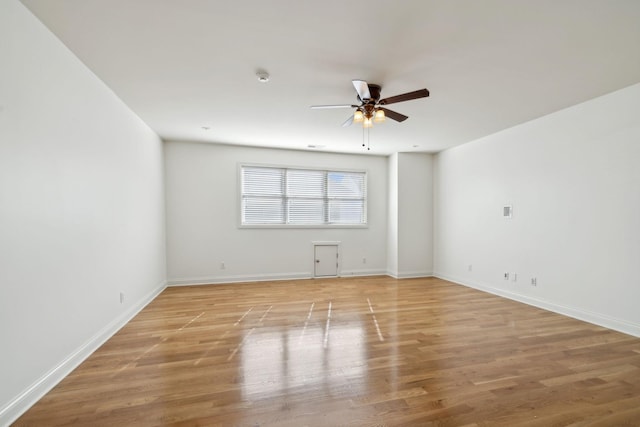 unfurnished room featuring light hardwood / wood-style floors and ceiling fan