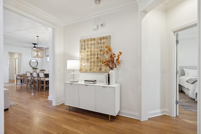 interior space with ornamental molding and hardwood / wood-style floors