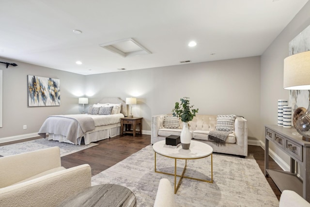 bedroom with dark hardwood / wood-style floors