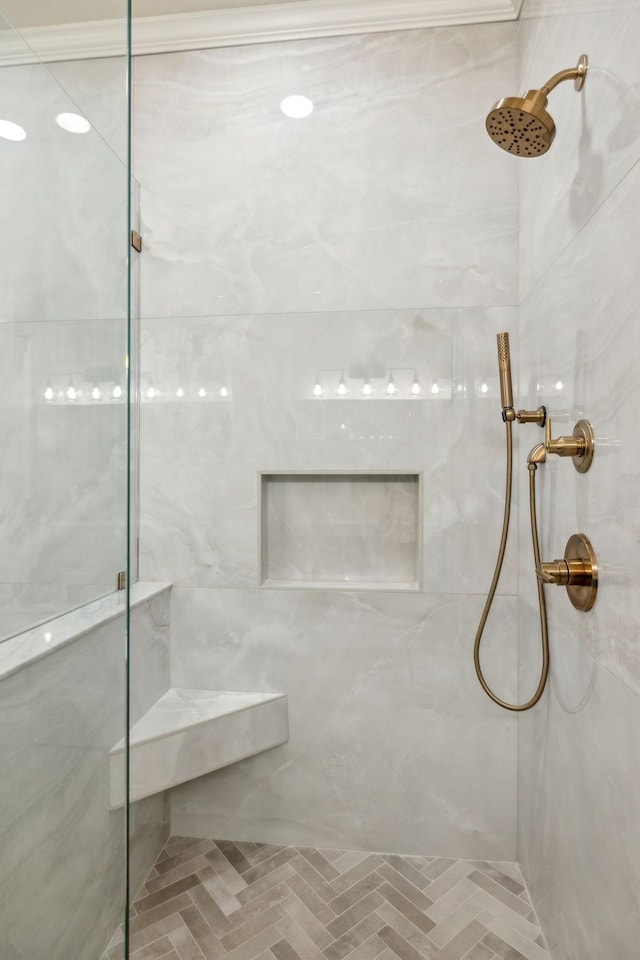 bathroom with a tile shower