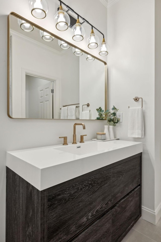 bathroom with vanity, ornamental molding, and tile patterned floors