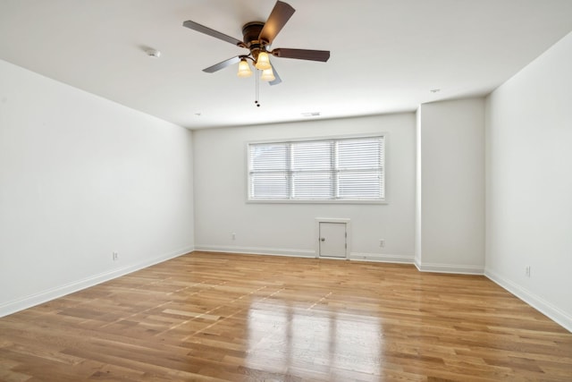 empty room featuring ceiling fan and light hardwood / wood-style flooring