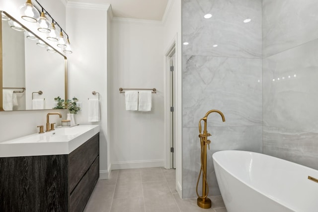 bathroom featuring tile patterned flooring, vanity, a washtub, and crown molding