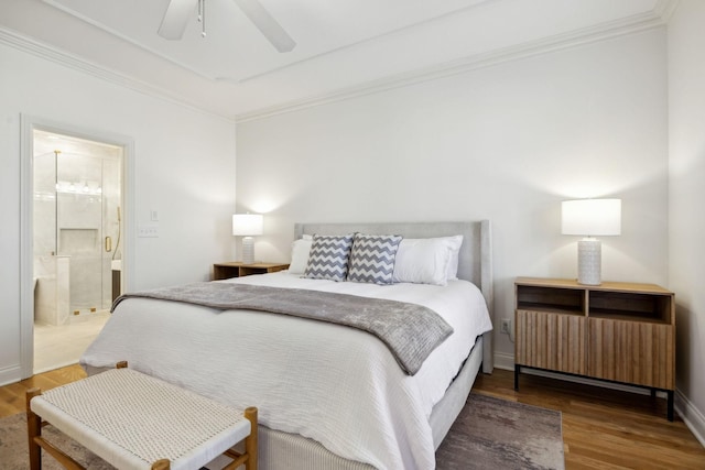 bedroom with crown molding, ensuite bath, wood-type flooring, and ceiling fan