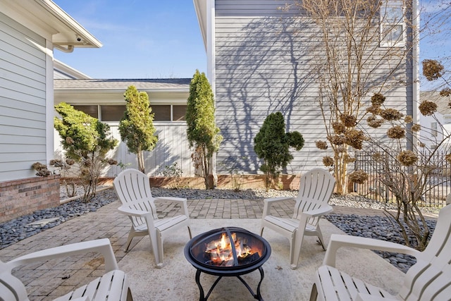 view of patio / terrace featuring an outdoor fire pit