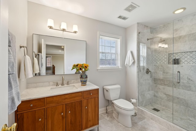 bathroom with walk in shower, tile patterned floors, vanity, and toilet