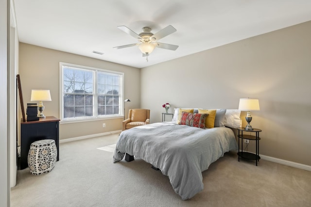 bedroom with light colored carpet and ceiling fan