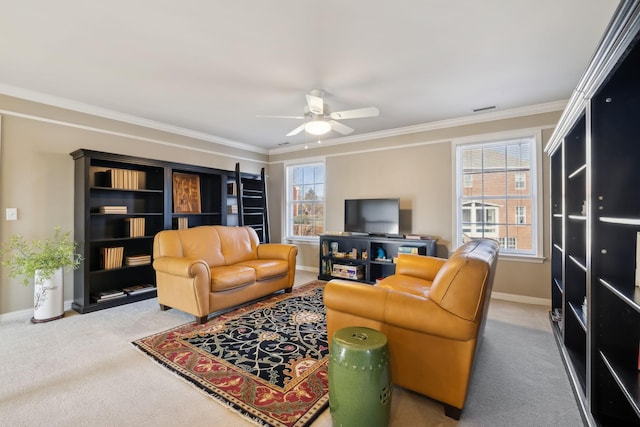 living room with crown molding, ceiling fan, and carpet floors