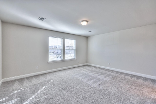 unfurnished room featuring carpet floors