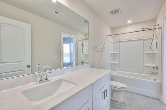 full bathroom with vanity, shower / washtub combination, tile patterned floors, and toilet