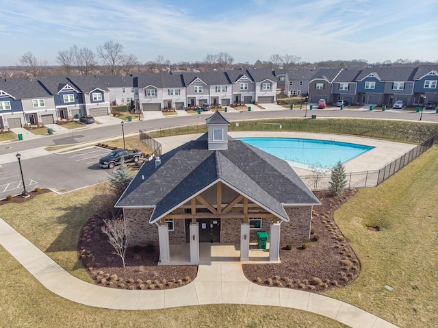 view of pool with a patio area and a lawn