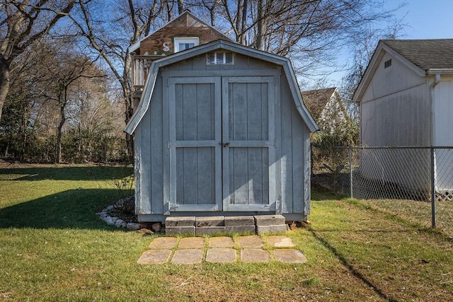 view of outbuilding featuring a yard