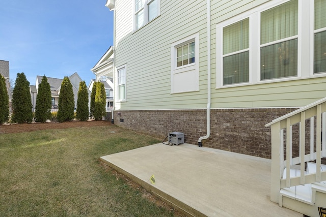 view of home's exterior featuring a yard and a patio area