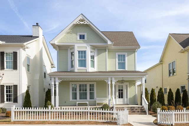 victorian-style house featuring covered porch