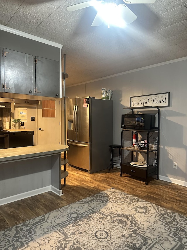 kitchen with dark wood-type flooring, ornamental molding, ceiling fan, and stainless steel refrigerator with ice dispenser