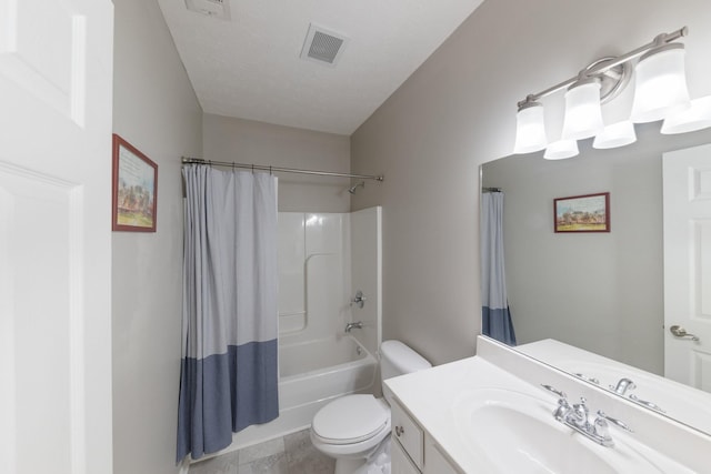 full bathroom with vanity, toilet, shower / tub combo, and a textured ceiling