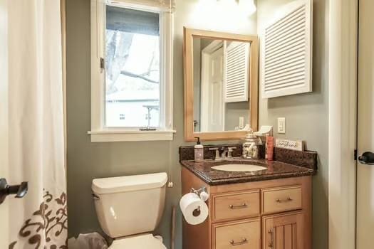 bathroom featuring vanity and toilet