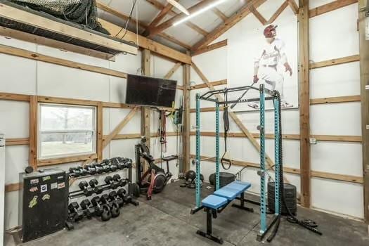 exercise room featuring vaulted ceiling