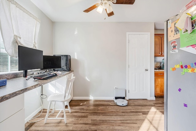 home office featuring hardwood / wood-style floors and ceiling fan