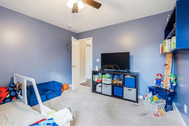 rec room featuring ceiling fan and carpet flooring