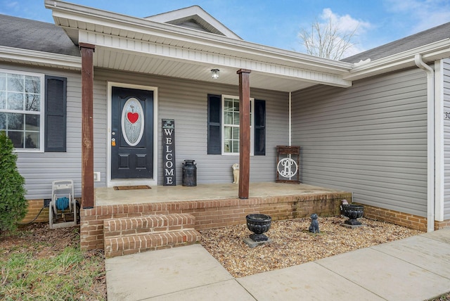 doorway to property featuring covered porch