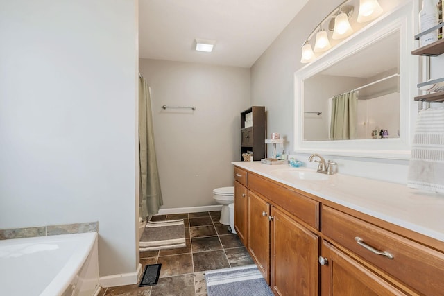 bathroom featuring vanity, toilet, and a bathing tub