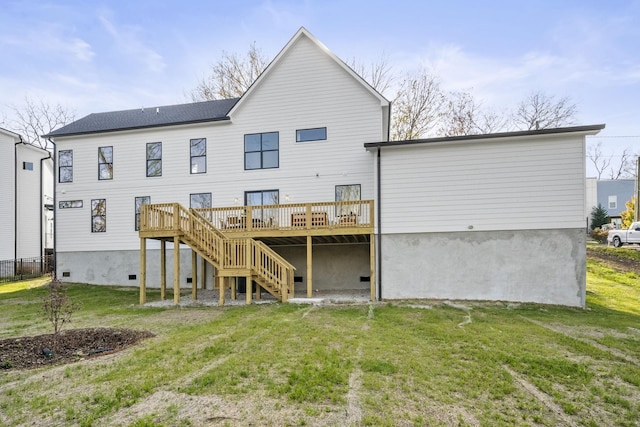 back of house with a wooden deck and a lawn