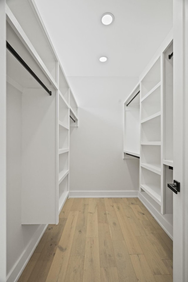 walk in closet featuring light hardwood / wood-style floors