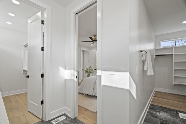 bathroom featuring hardwood / wood-style floors and ceiling fan