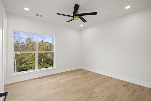 spare room featuring ceiling fan and light hardwood / wood-style flooring