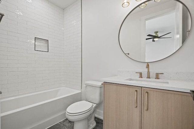 full bathroom with ceiling fan, vanity, tile patterned floors, toilet, and tiled shower / bath