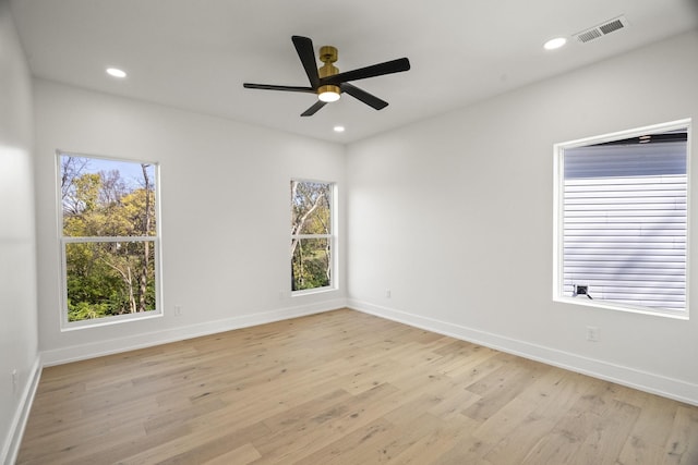 spare room featuring ceiling fan and light wood-type flooring