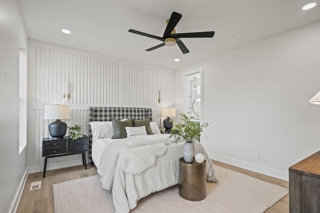 bedroom with ceiling fan and light hardwood / wood-style flooring