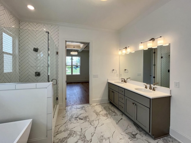 bathroom featuring crown molding, vanity, independent shower and bath, and washer / dryer