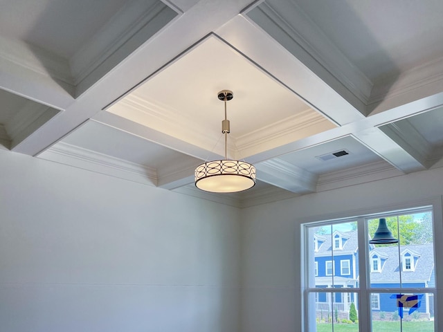 room details featuring coffered ceiling, ornamental molding, and beam ceiling