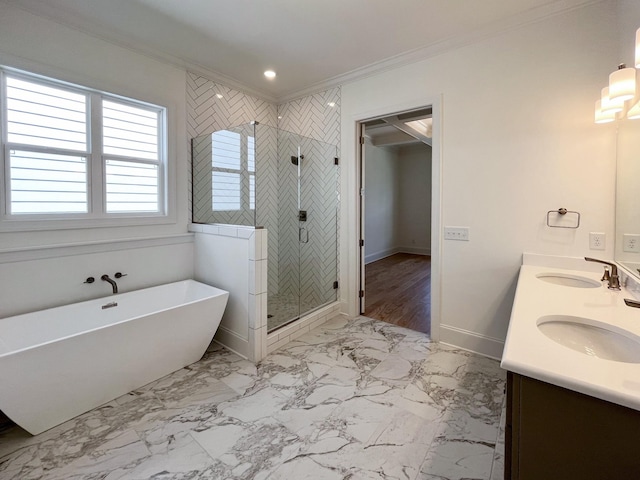 bathroom featuring crown molding, vanity, and shower with separate bathtub