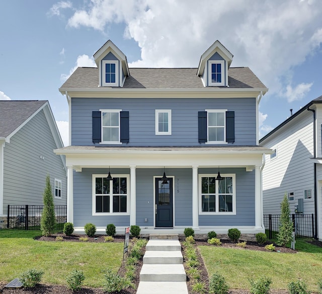 view of front of property with a porch and a front yard