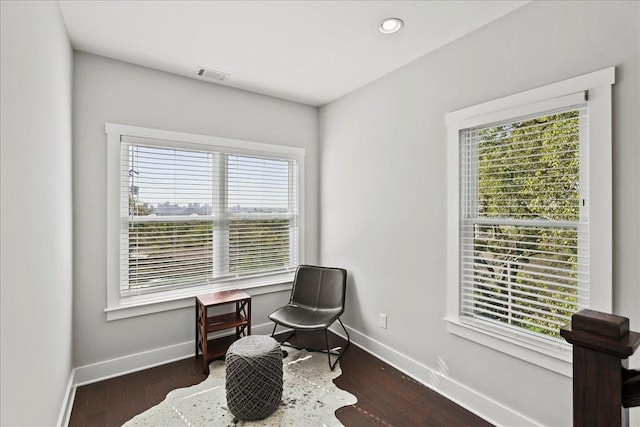 sitting room featuring dark hardwood / wood-style flooring